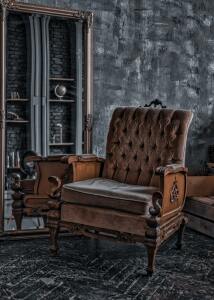 Antique chair in an older looking room.